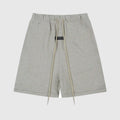 Essentials Light Heather Oatmeal fleece shorts front view – Fear of God