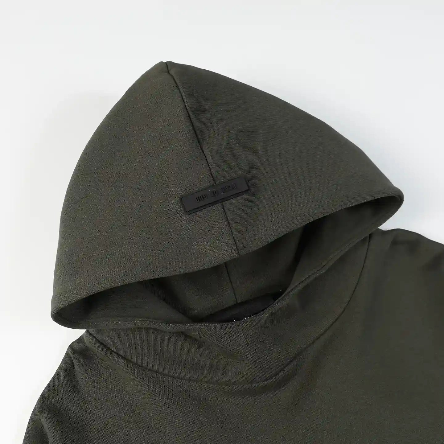 essentials lunar green hoodie front view minimalist design