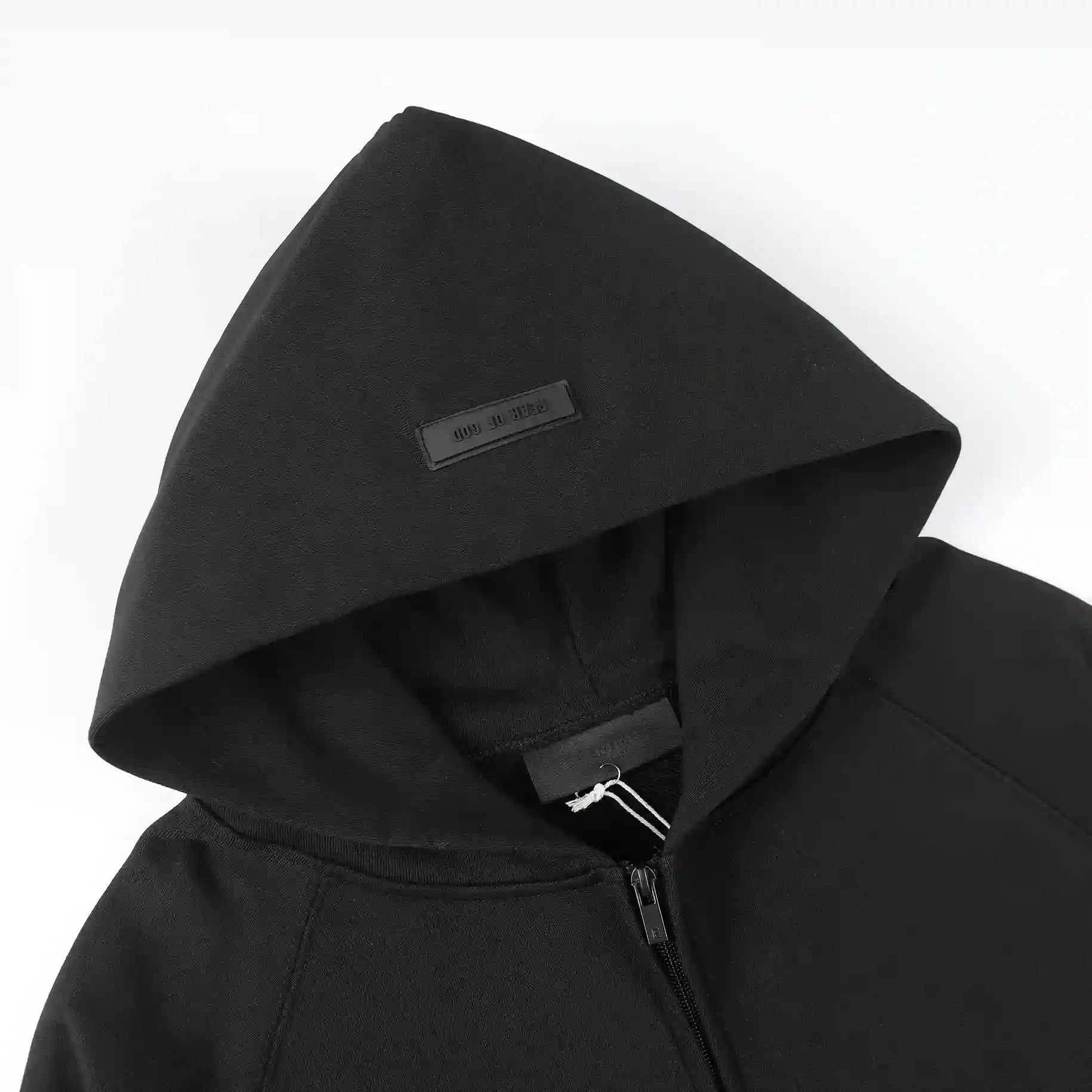 essentials black zip hoodie front view zipper detail