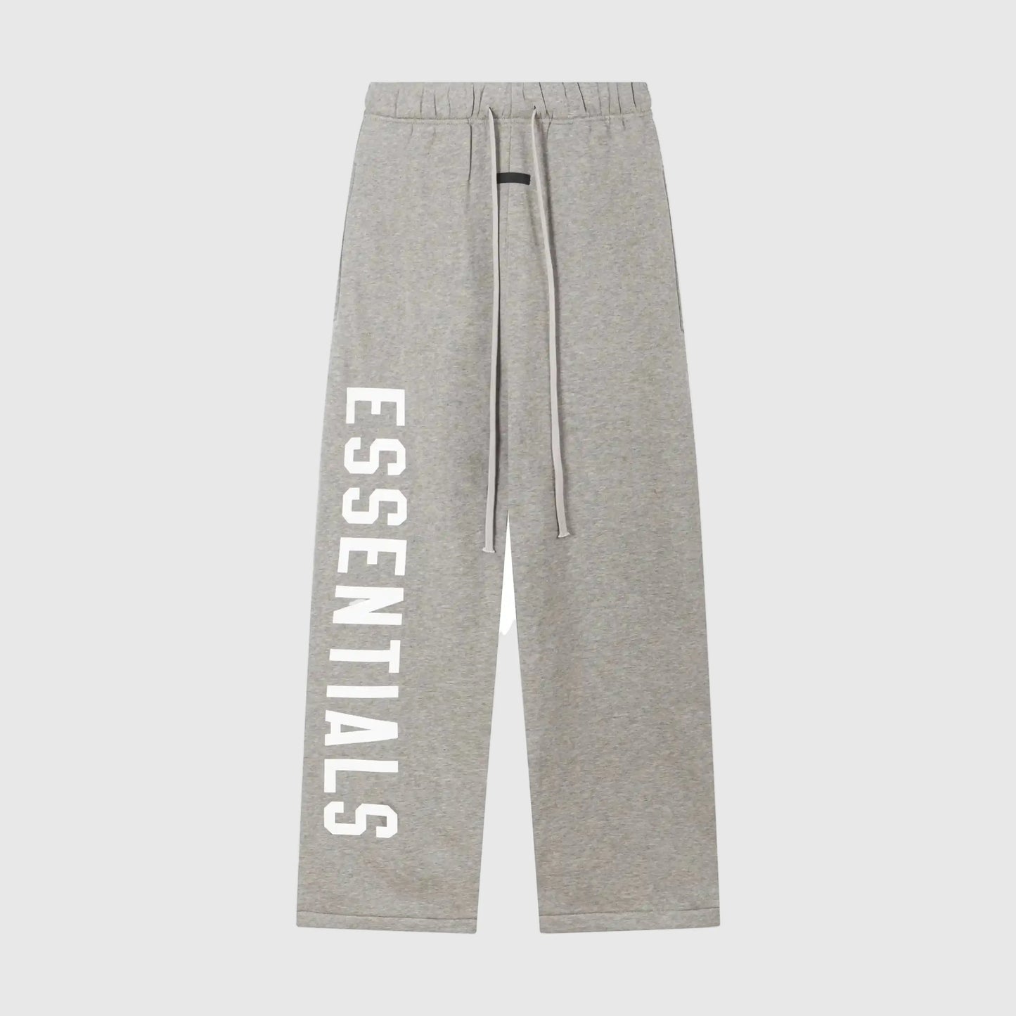 Essentials light heather oatmeal street fleece sweatpants by Fear of God front view