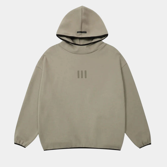 Fear of God Essentials cement hoodie front view with rubberized black bar branding