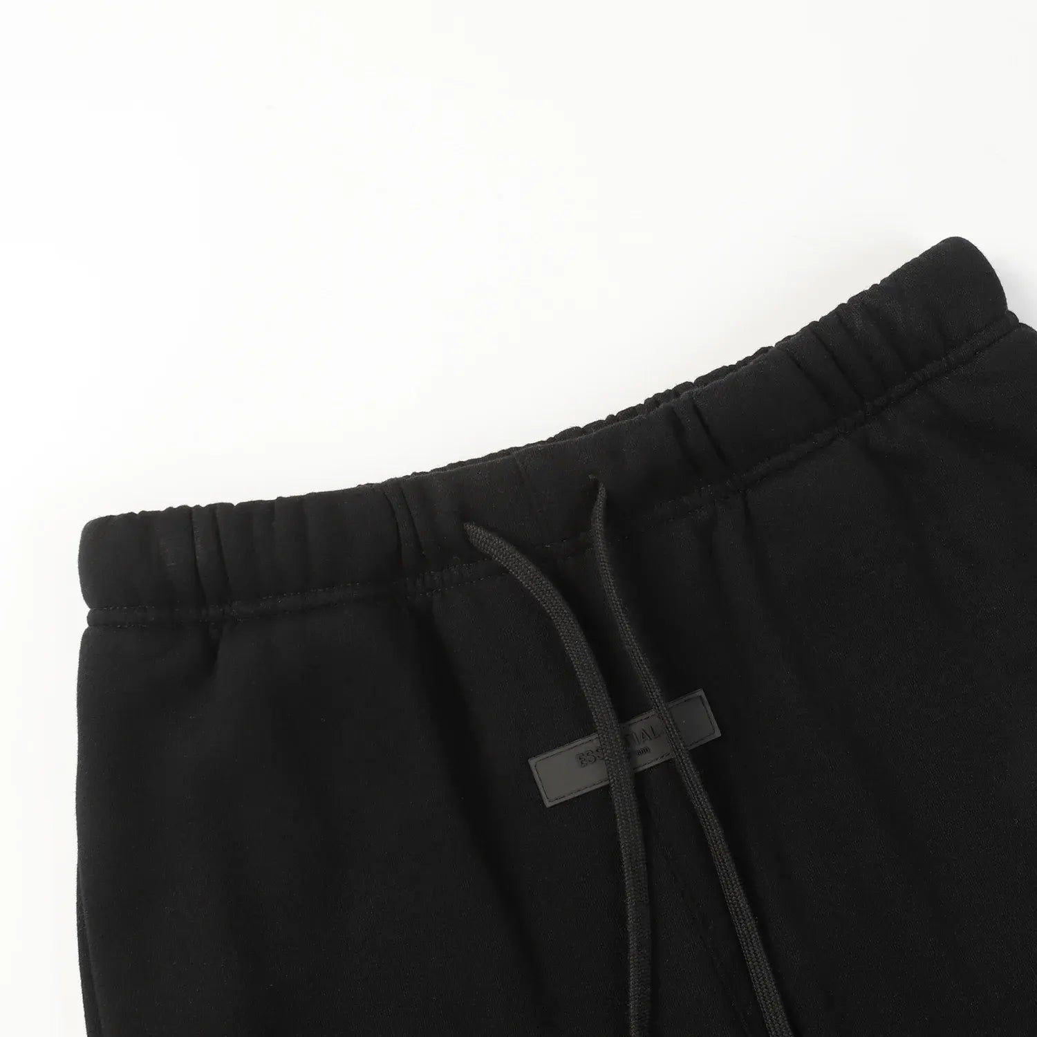 Premium fleece fabric detail on black sweatpants by Fear of God