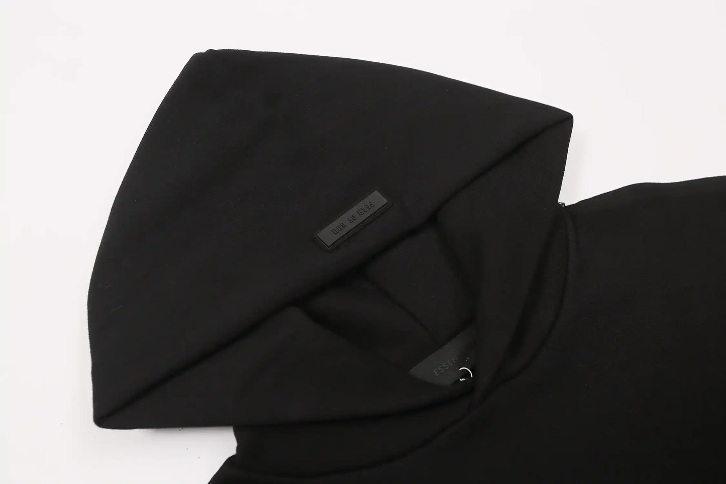 essentials black hoodie front view minimalist design
