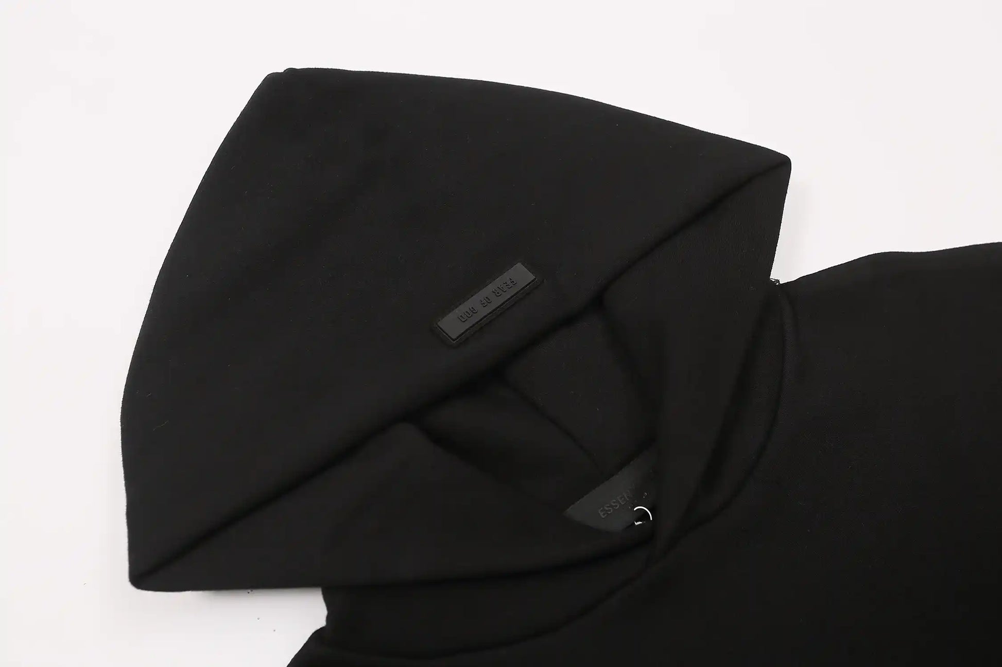 essentials black hoodie front view minimalist design