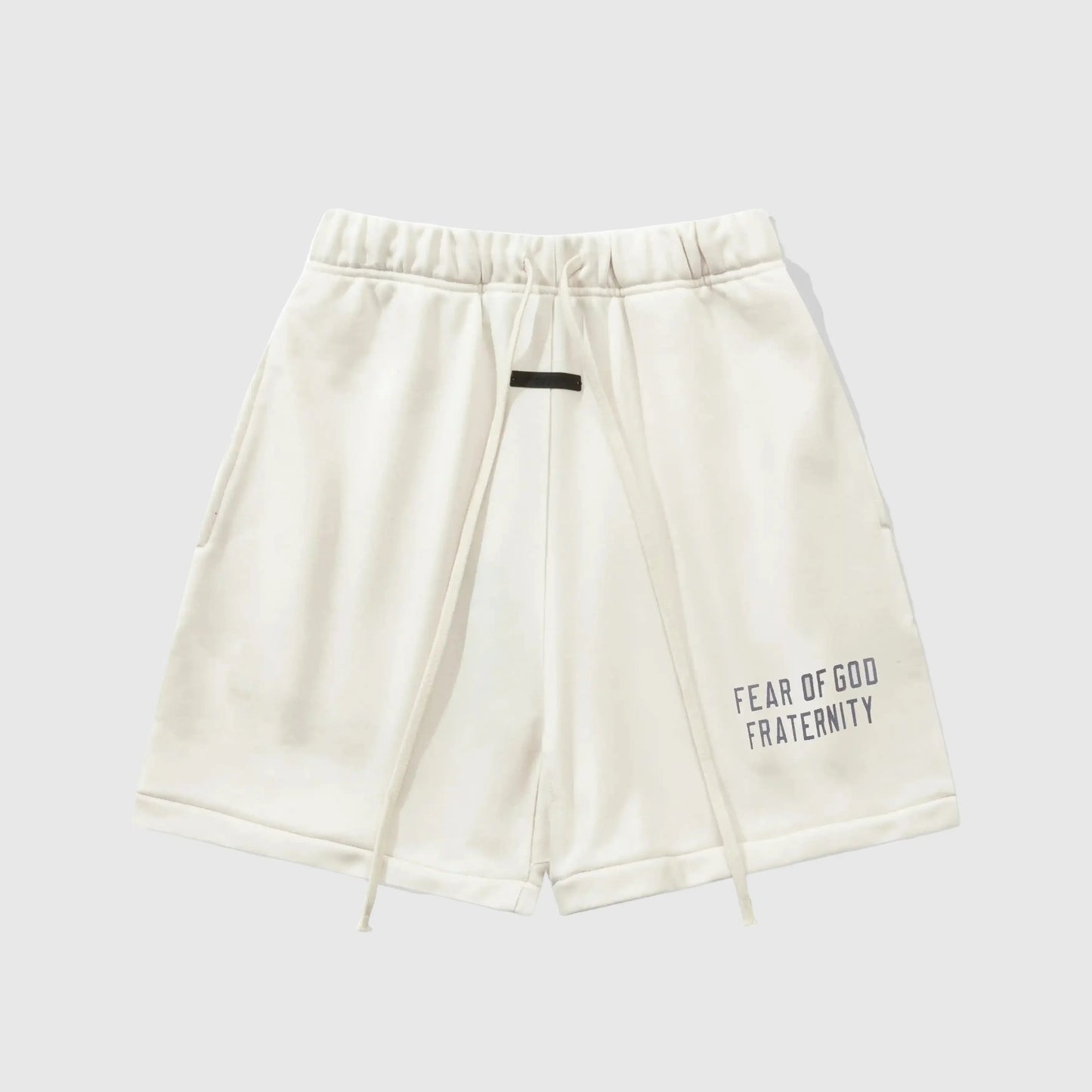 Fear of God Essentials Cloud Dance fleece shorts in light grey with tonal logo and relaxed silhouette