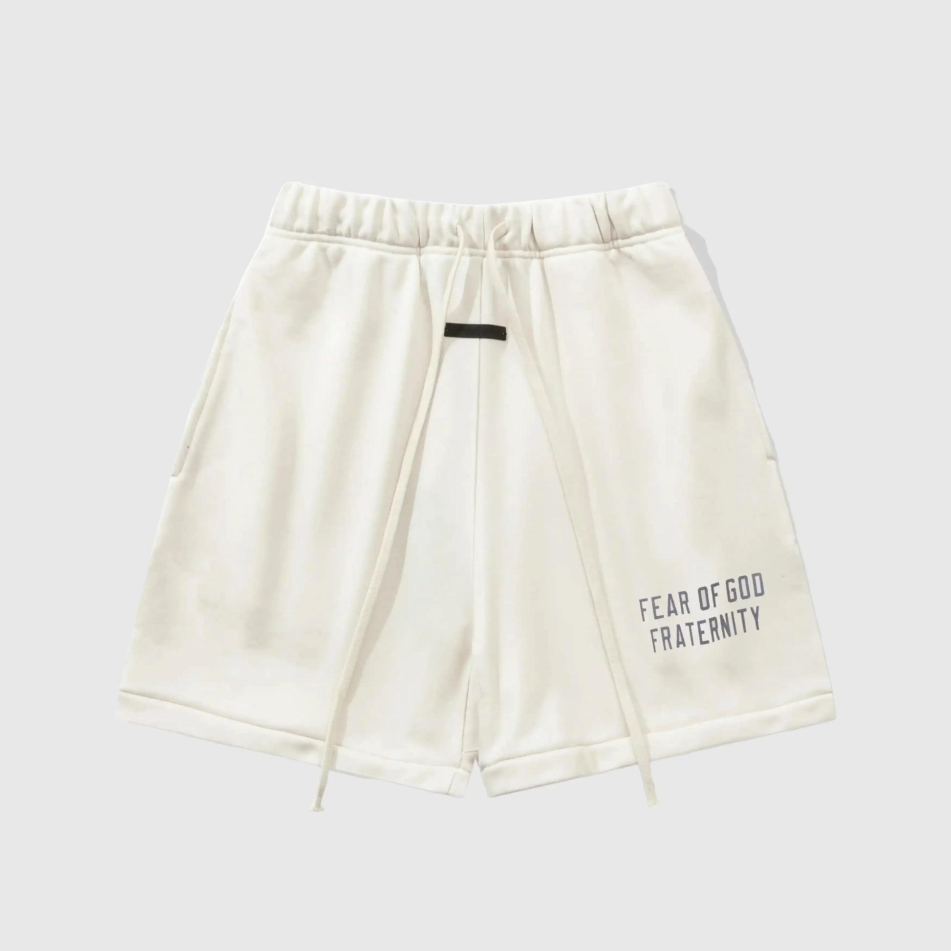 Fear of God Essentials Cloud Dance fleece shorts in light grey with tonal logo and relaxed silhouette
