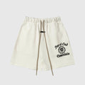Fear of God Essentials Cloud Dance fleece shorts in soft light grey with tonal branding and relaxed fit