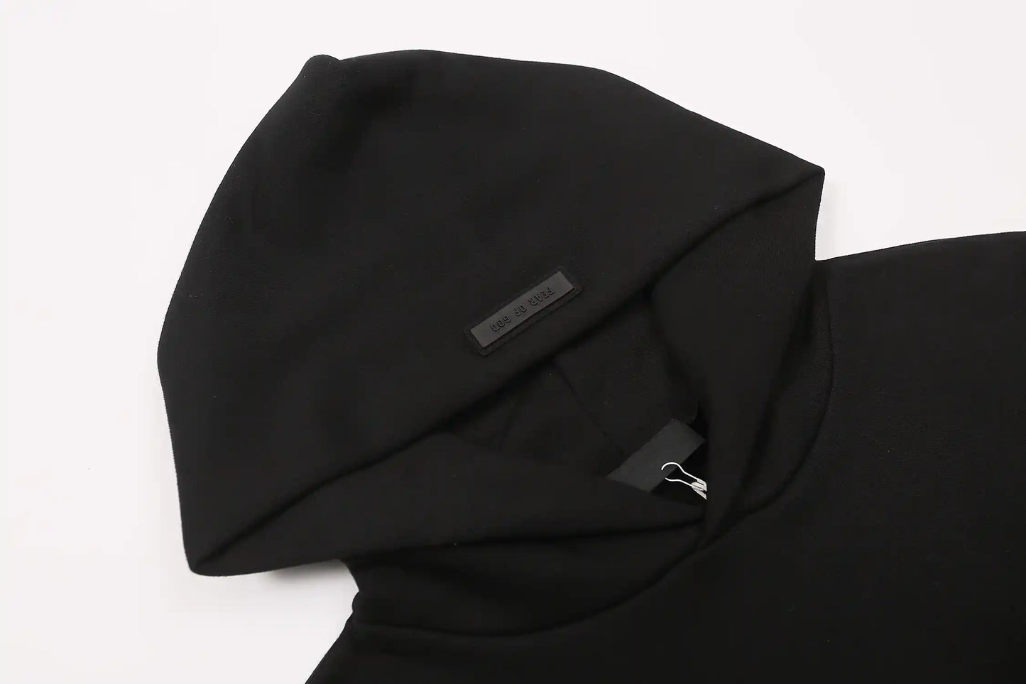 essentials black hoodie front view minimalist design