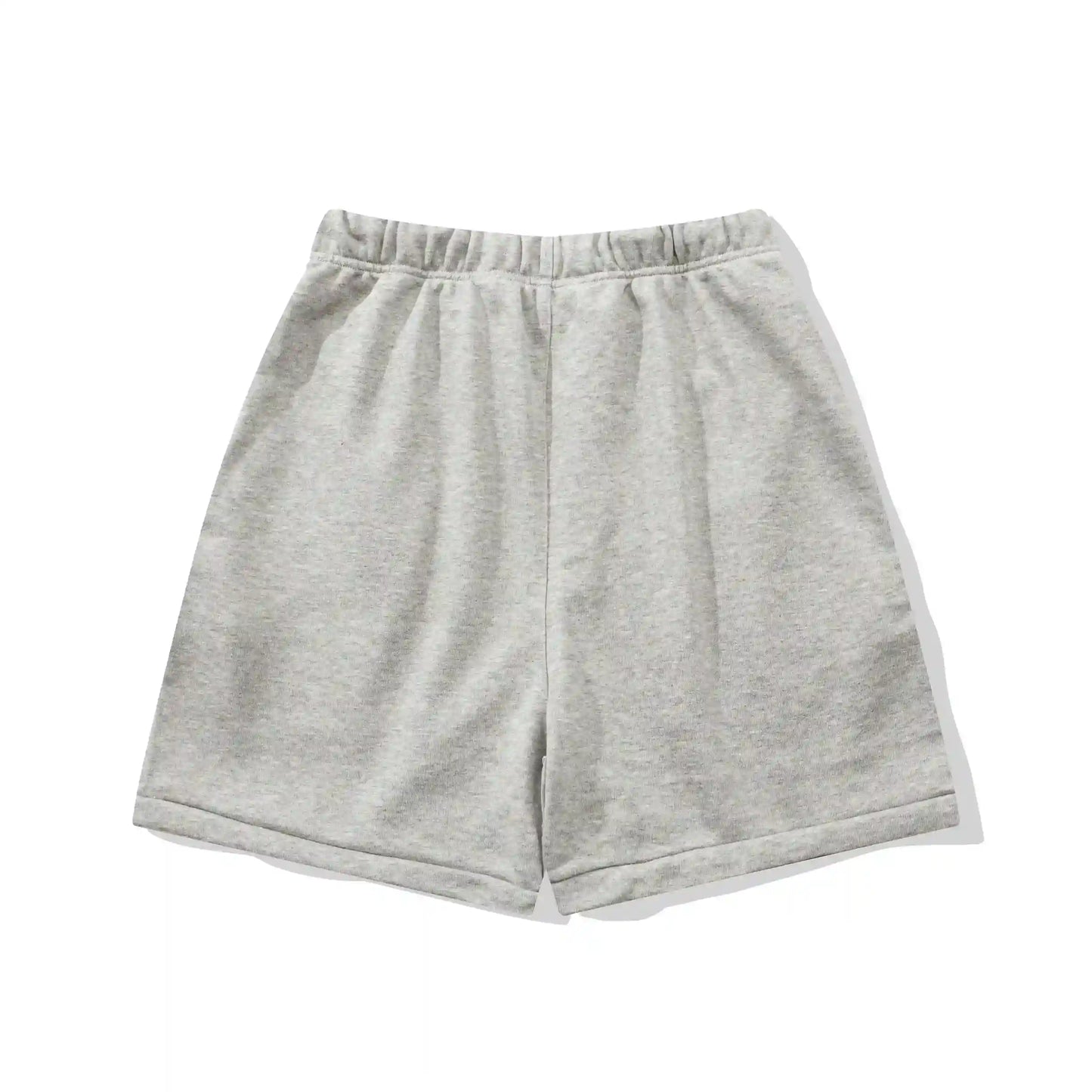 Fear of God Essentials Light Heather Oatmeal fleece shorts relaxed fit side view