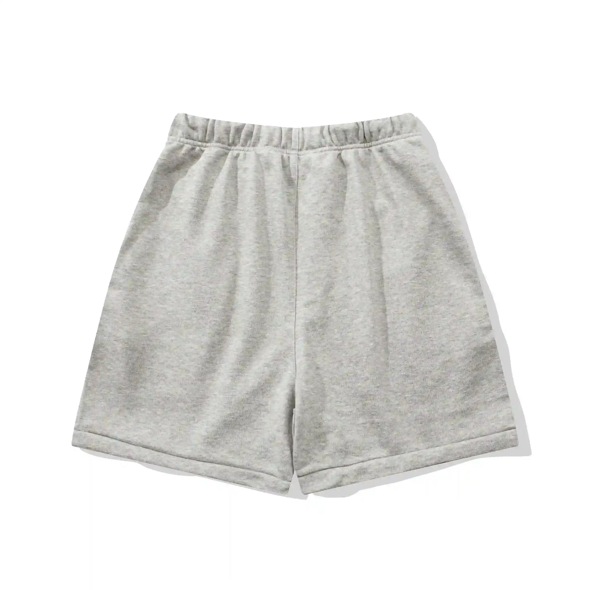 Fear of God Essentials Light Heather Oatmeal fleece shorts relaxed fit side view