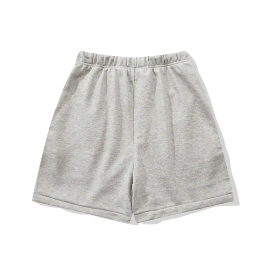 Fear of God Essentials Light Heather Oatmeal fleece shorts relaxed fit side view
