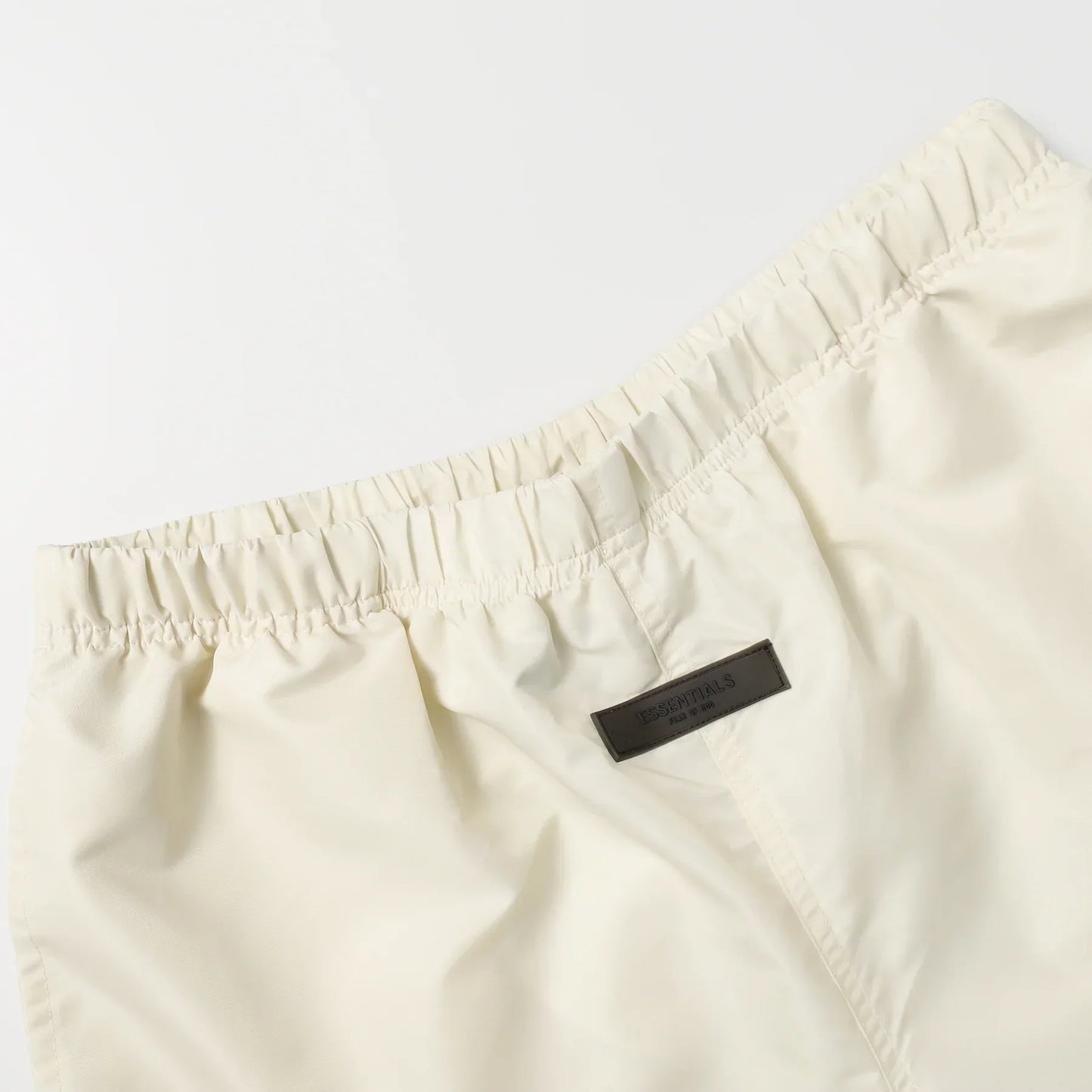 Fear of God Essentials Cloud Dance Shorts in light grey fleece with drawstring waistband