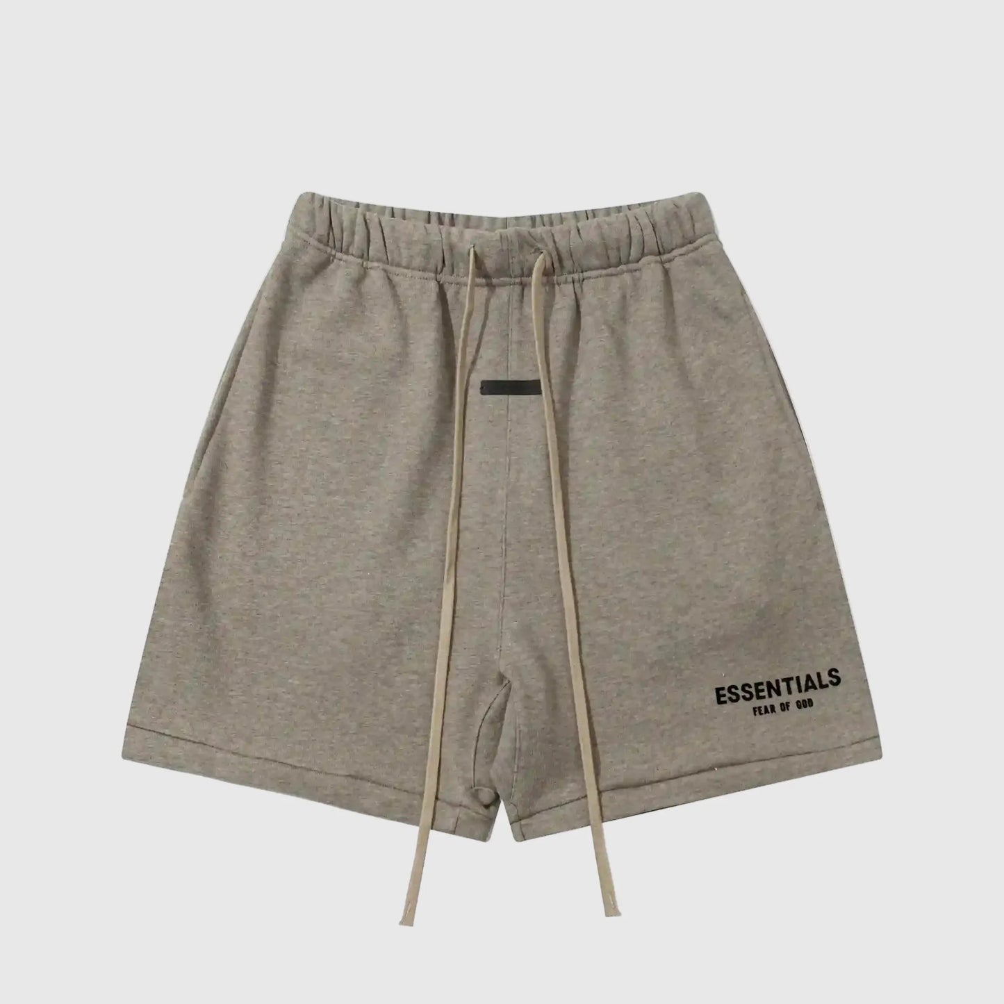 Fear of God Essentials Almond Frost fleece shorts in warm neutral tone with tonal logo and relaxed fit