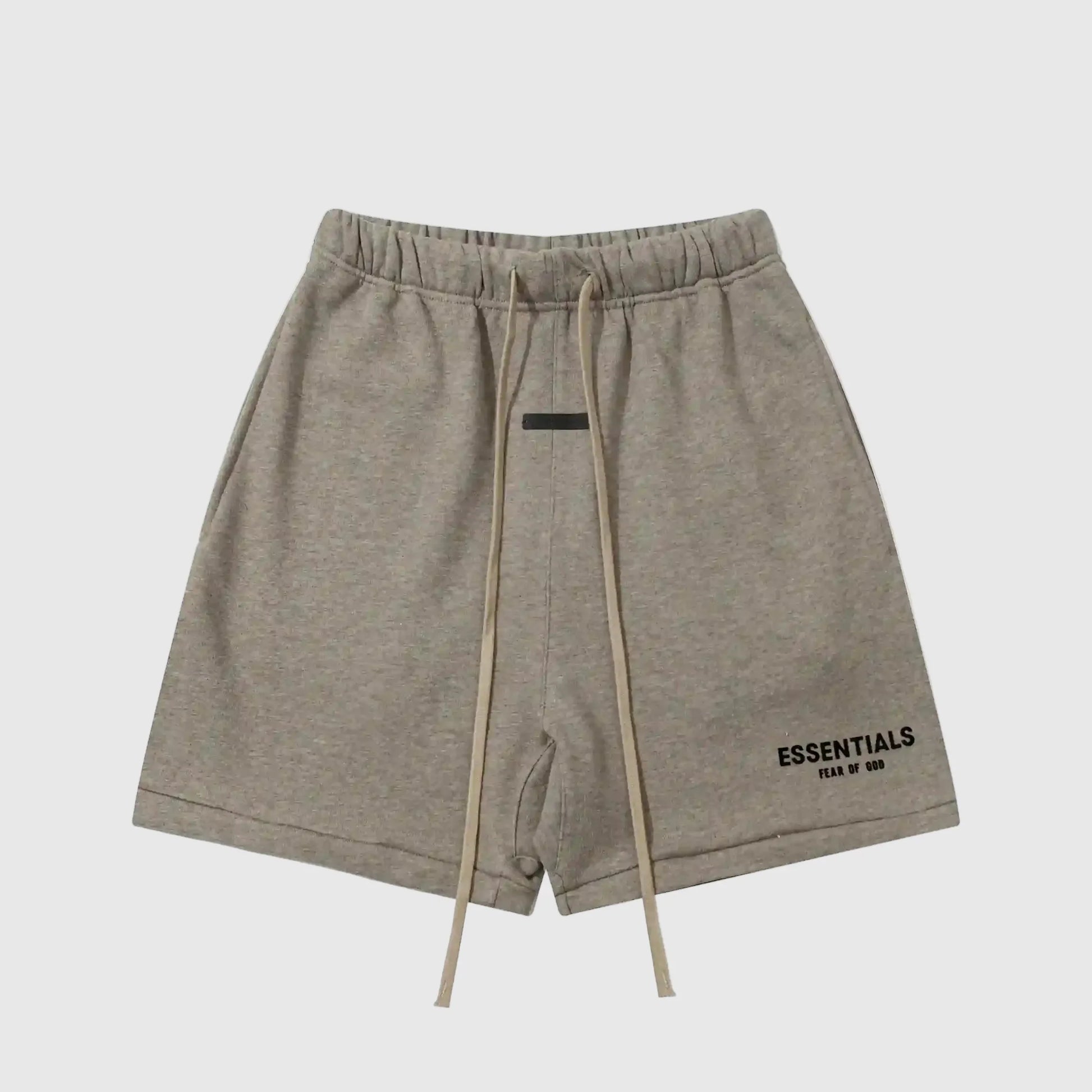 Fear of God Essentials Almond Frost fleece shorts in warm neutral tone with tonal logo and relaxed fit