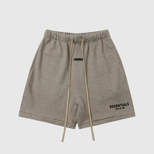 Fear of God Essentials Almond Frost fleece shorts in warm neutral tone with tonal logo and relaxed fit