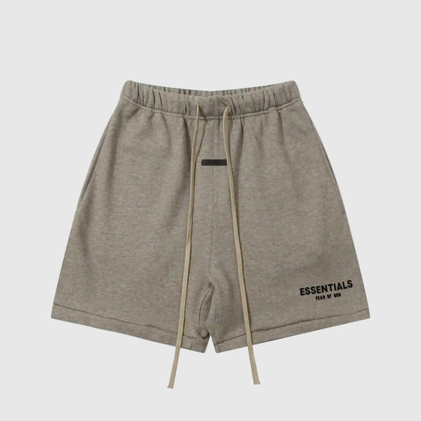 Fear of God Essentials Almond Frost fleece shorts in warm neutral tone with tonal logo and relaxed fit