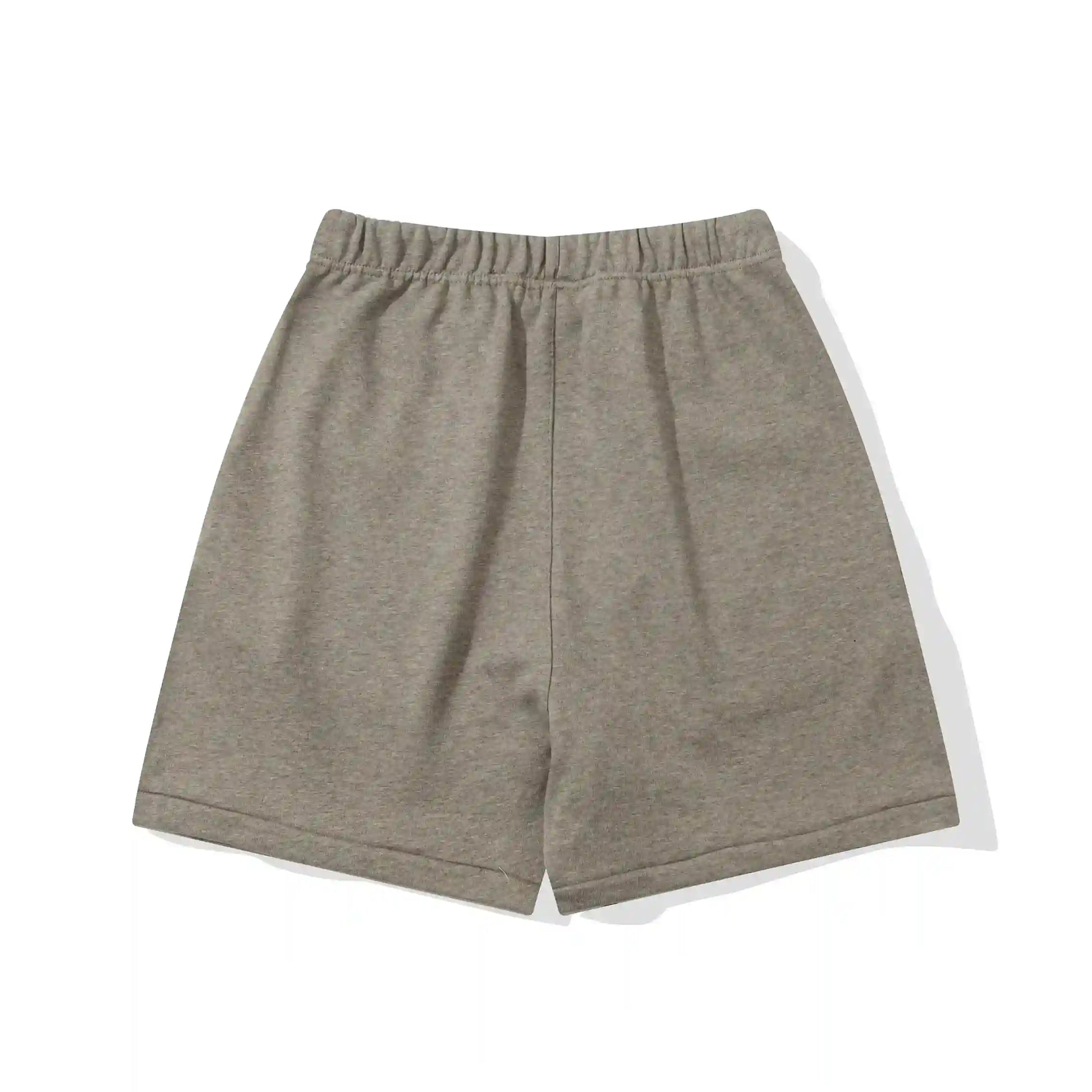 Fear of God Essentials Almond Frost fleece shorts in warm neutral tone with tonal logo and relaxed fit
