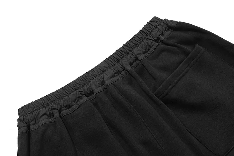 Fear of God Essentials black fleece shorts with tonal branding and relaxed streetwear fit