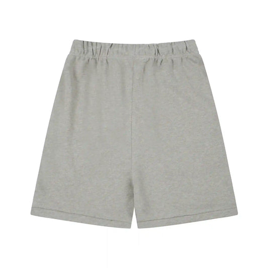 Fear of God Essentials Light Heather Oatmeal fleece shorts relaxed fit side view