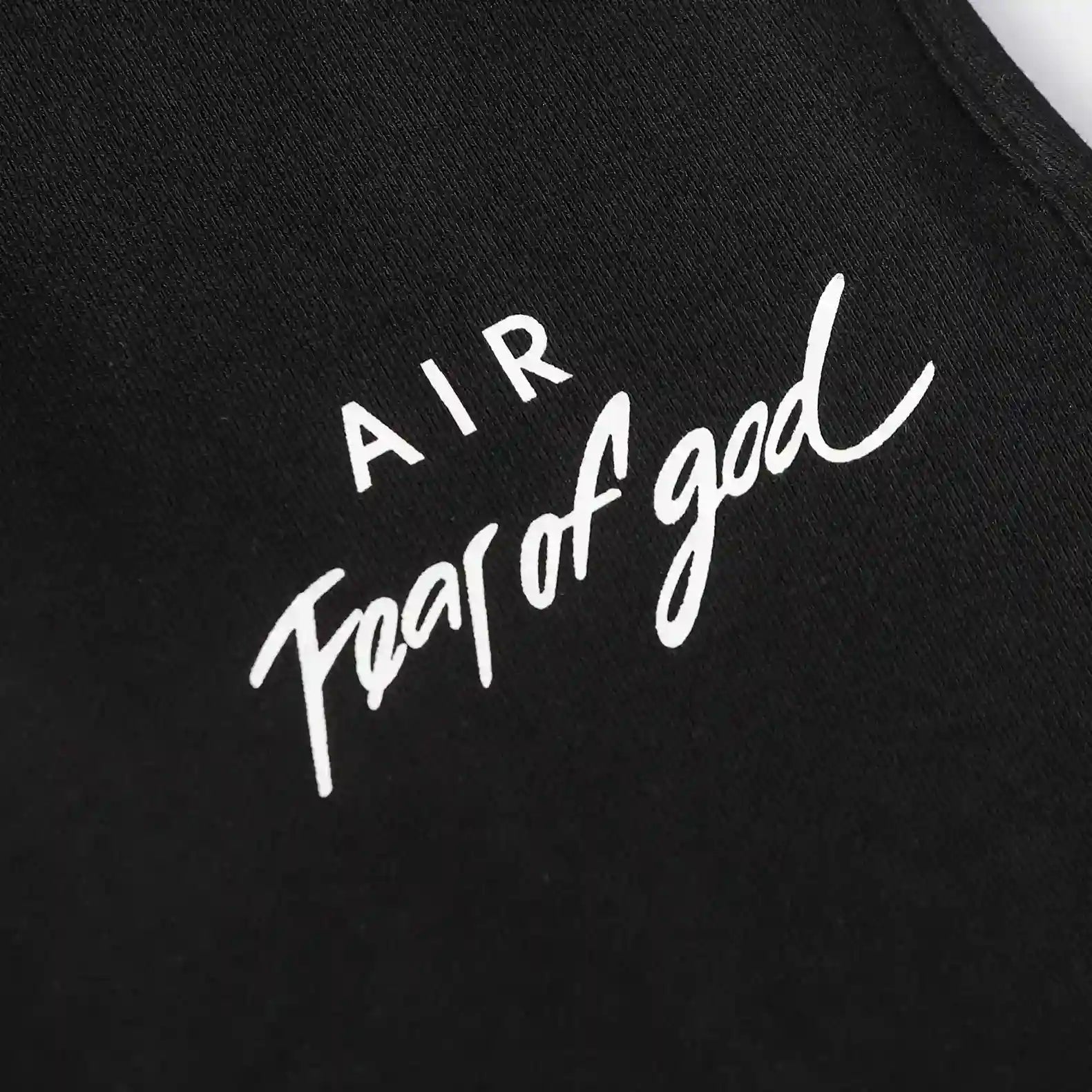 Jogger style black sweatpants by Fear of God with elastic waistband