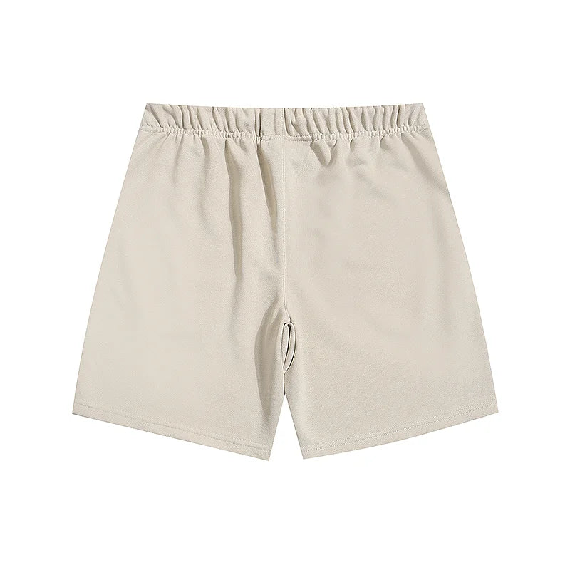 Fear of God Essentials Cloud Dance fleece shorts relaxed fit side view