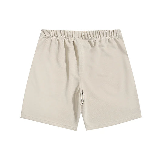 Fear of God Essentials Cloud Dance fleece shorts relaxed fit side view