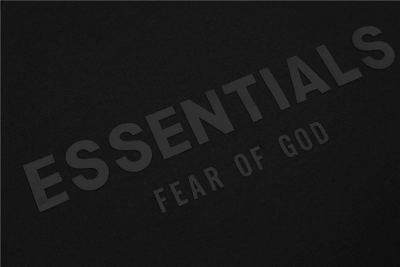 Fear of God Essentials black hoodie hood label detail