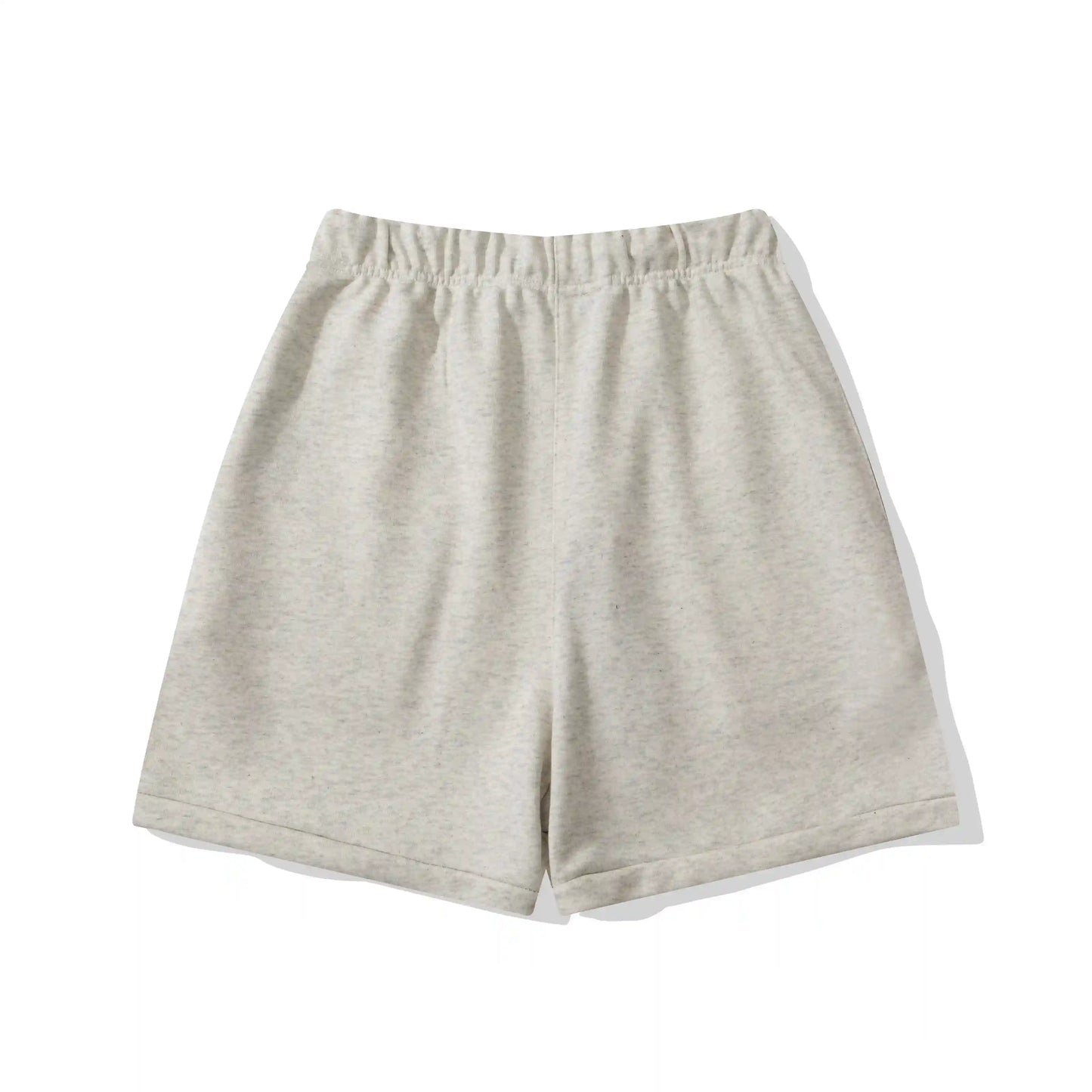 Fear of God Essentials Light Heather Oatmeal fleece shorts relaxed fit side view
