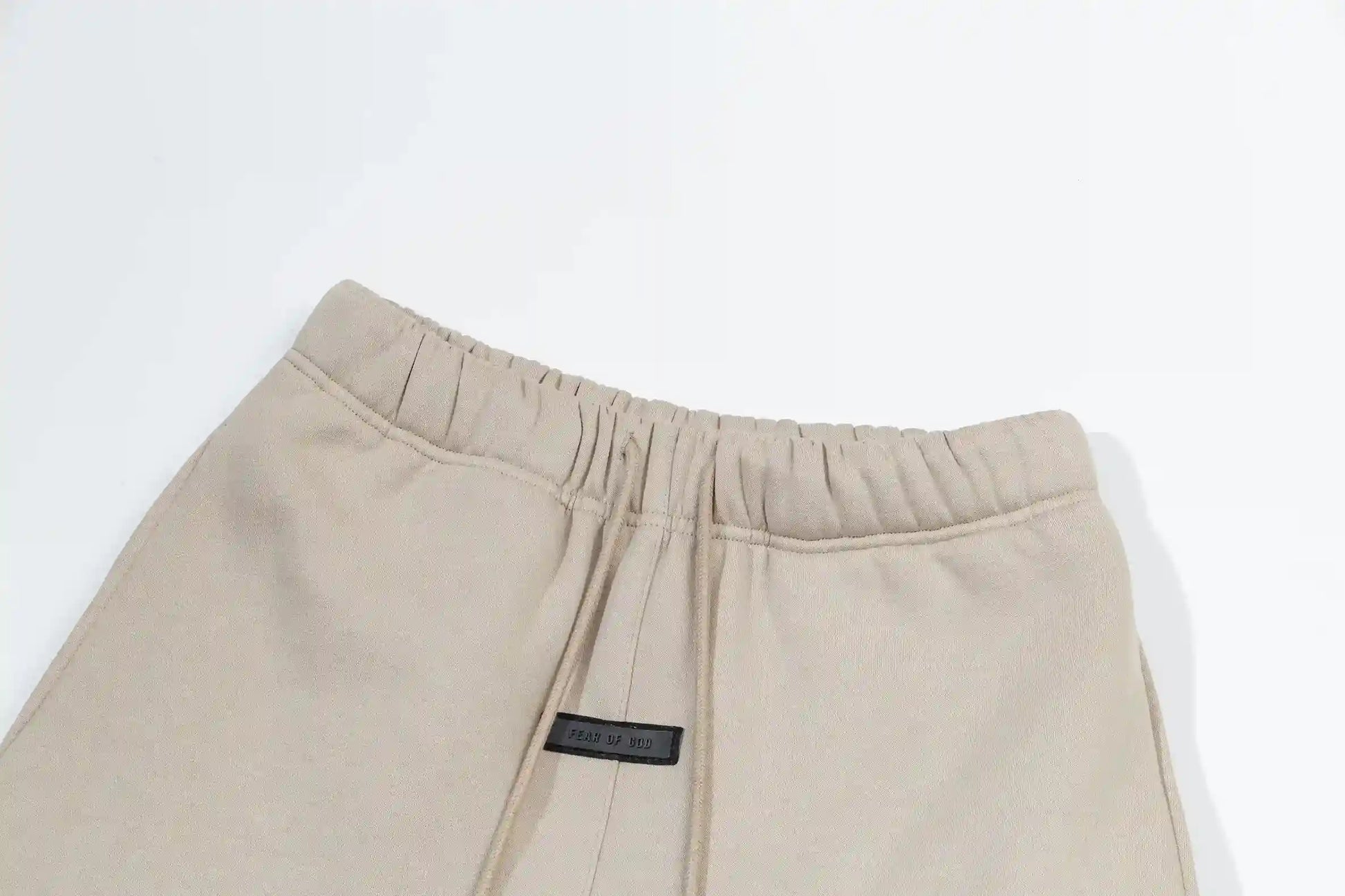 Premium fleece fabric detail on light cream sweatpants by Fear of God
