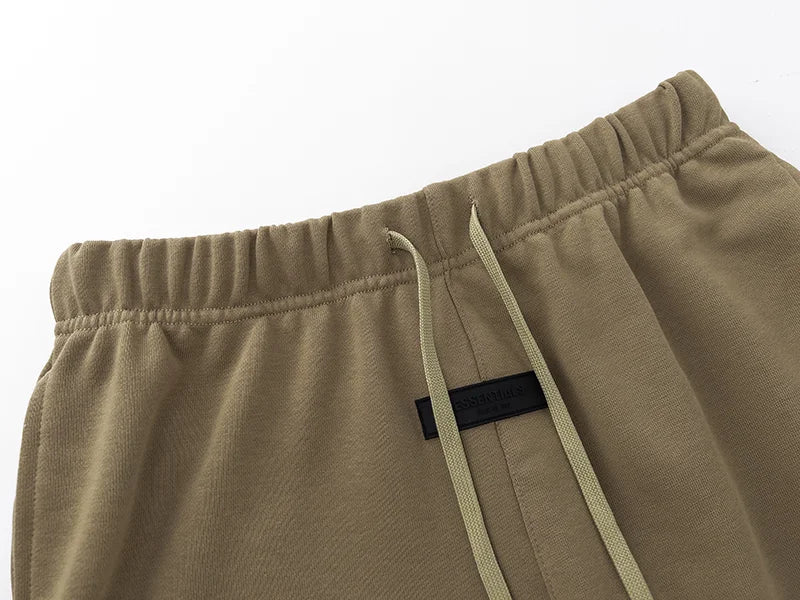 Essentials Dark Beige shorts tonal rubberized logo leg detail
