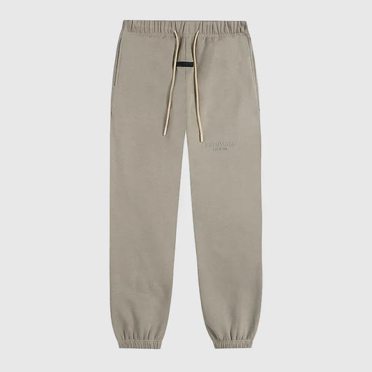 Essentials heathered grey signature fleece sweatpants by Fear of God front view
