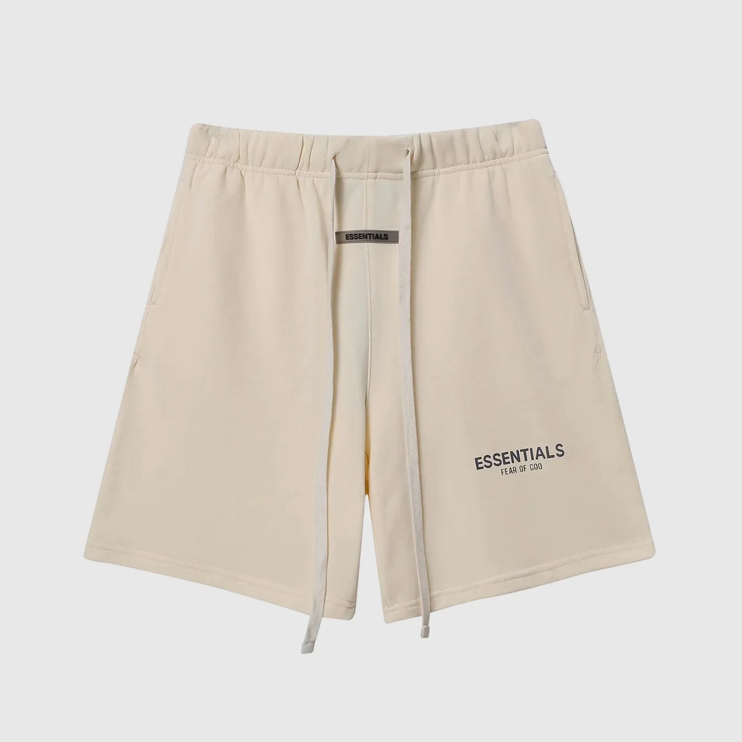 Fear of God Essentials light cream fleece shorts with tonal branding and relaxed silhouette