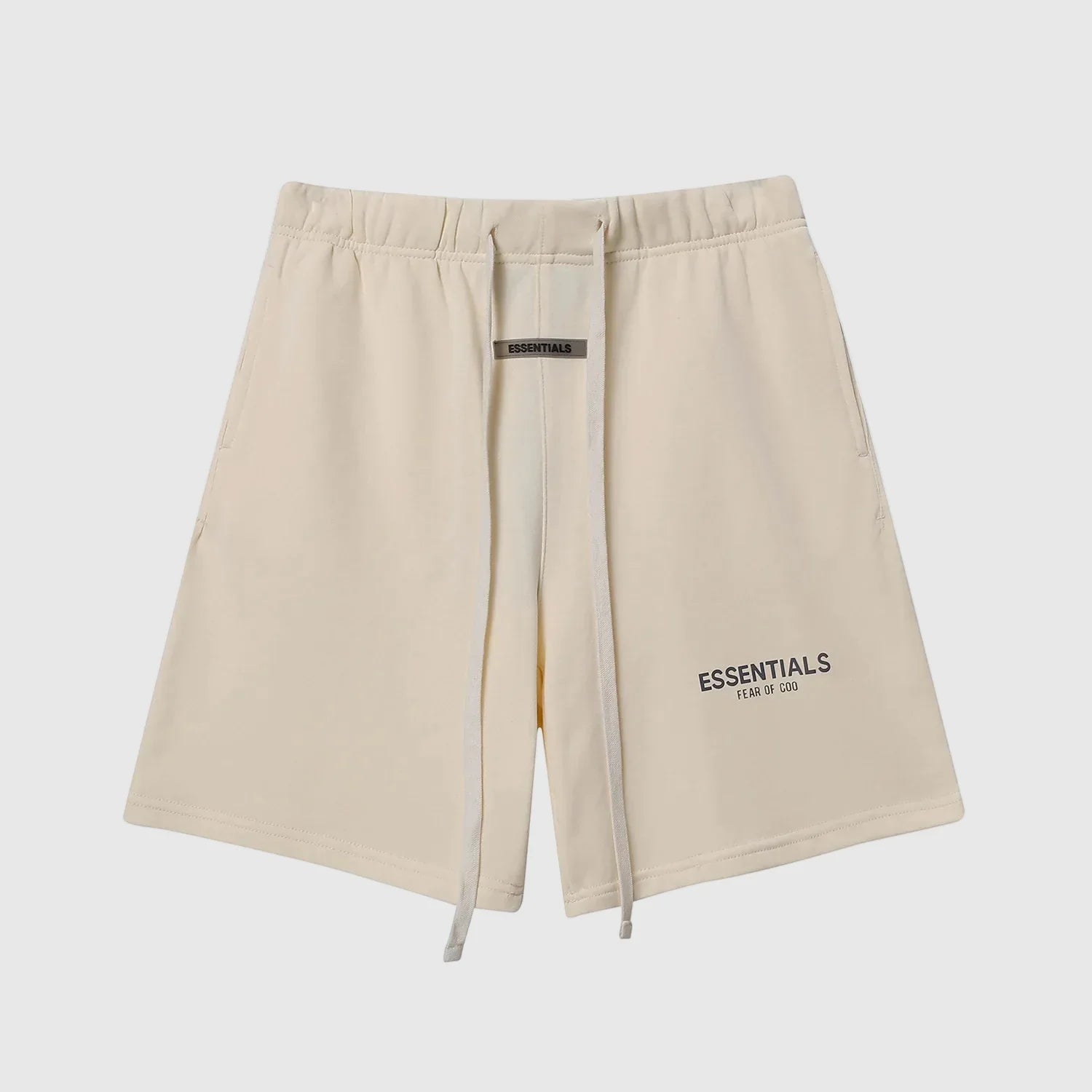 Fear of God Essentials light cream fleece shorts with tonal branding and relaxed silhouette
