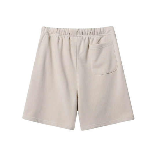 Fear of God Essentials Cloud Dance fleece shorts relaxed fit side view