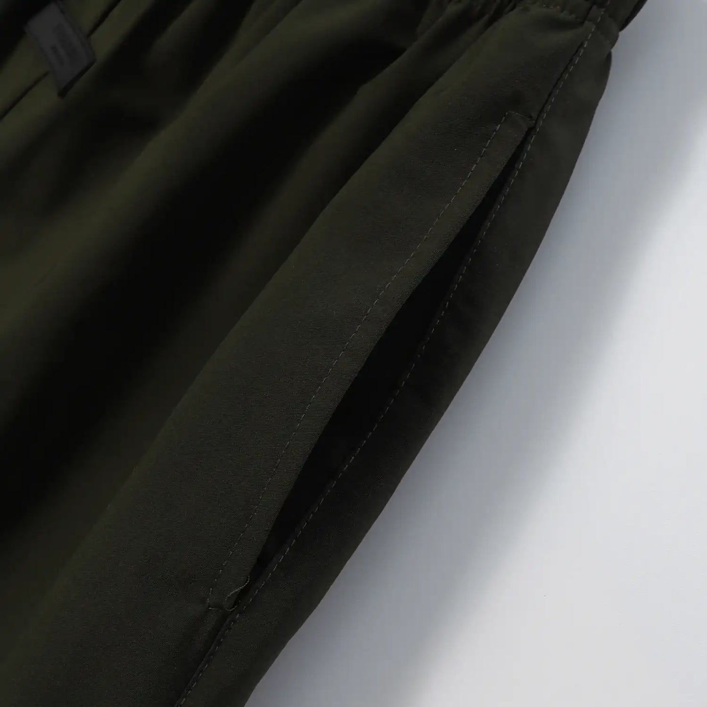 Fear of God Essentials Hemlock green fleece shorts with tonal logo and drawstring waistband