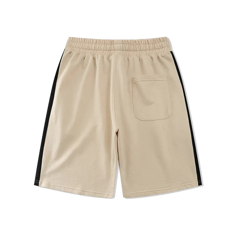 Fear of God Essentials Light Cream fleece shorts relaxed fit side view