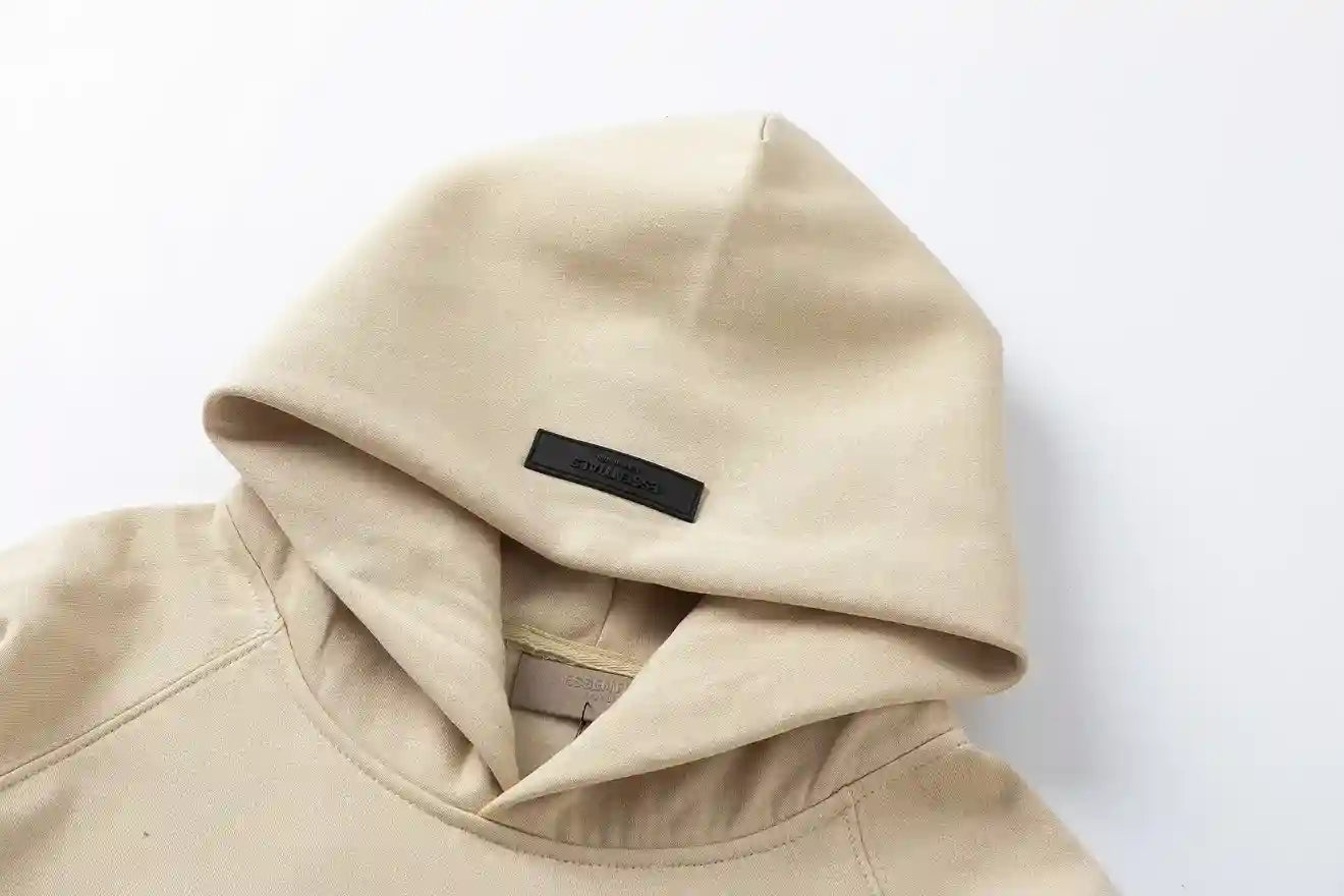 essentials beige hoodie front view minimalist design