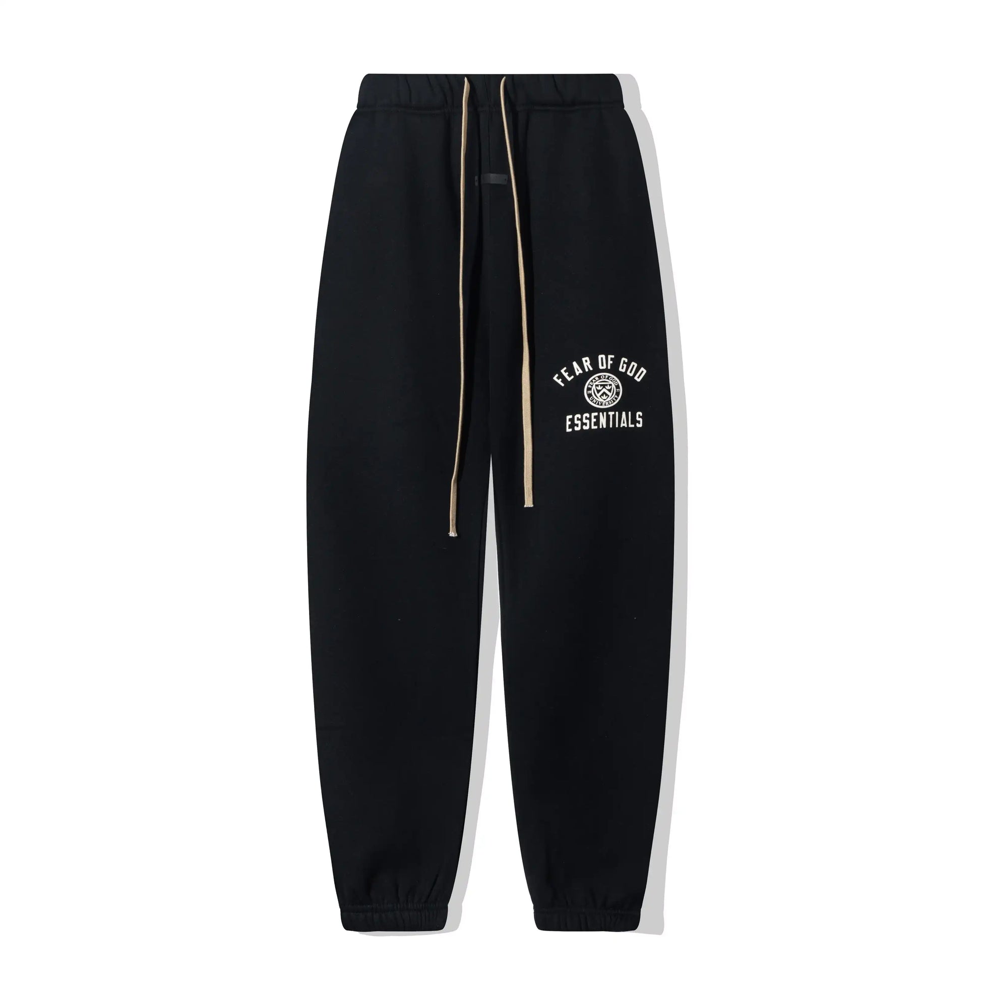 Black Essentials joggers soft-touch rubberized logo on leg close-up