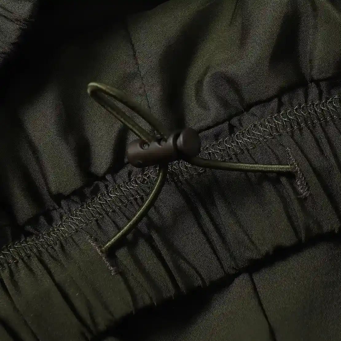 Fear of God Essentials Hemlock green fleece shorts with tonal logo and drawstring waistband