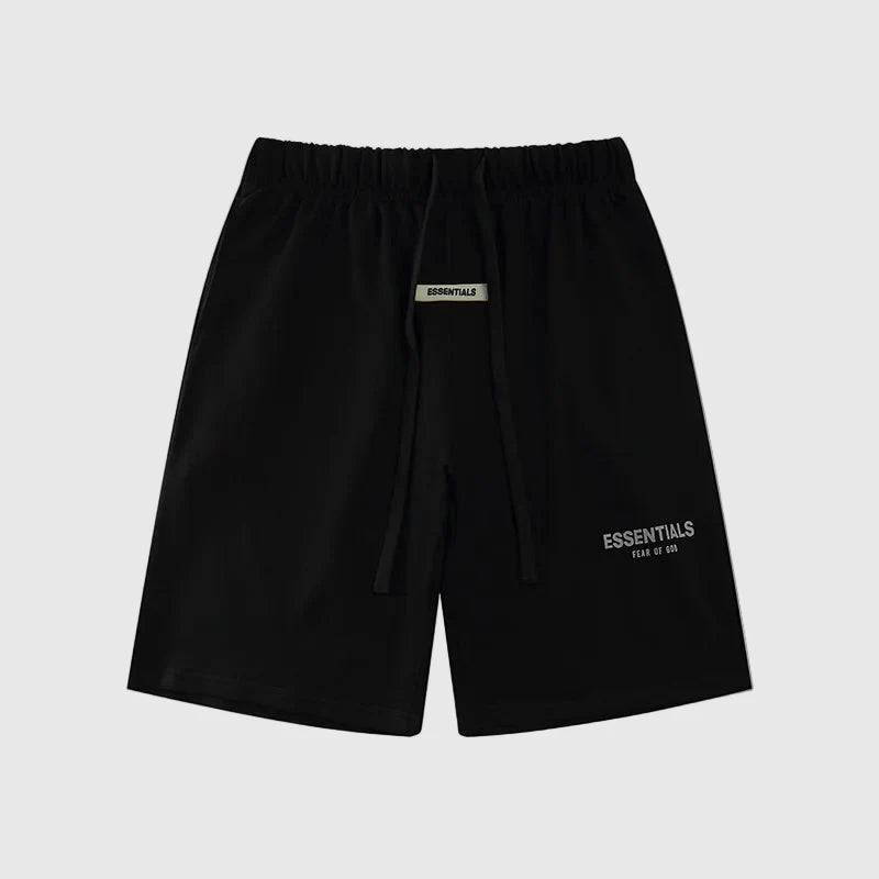Fear of God Essentials black fleece shorts with tonal logo and relaxed streetwear fit