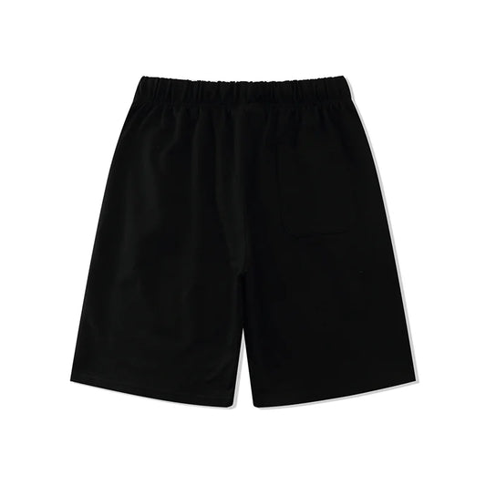 Fear of God Essentials black fleece shorts with tonal logo and relaxed streetwear fit