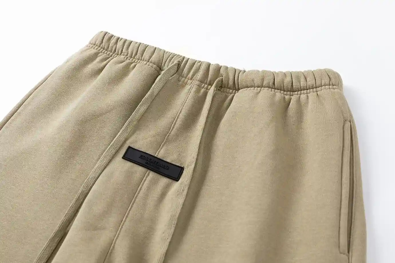 Premium fleece fabric detail on beige sweatpants by Fear Of God