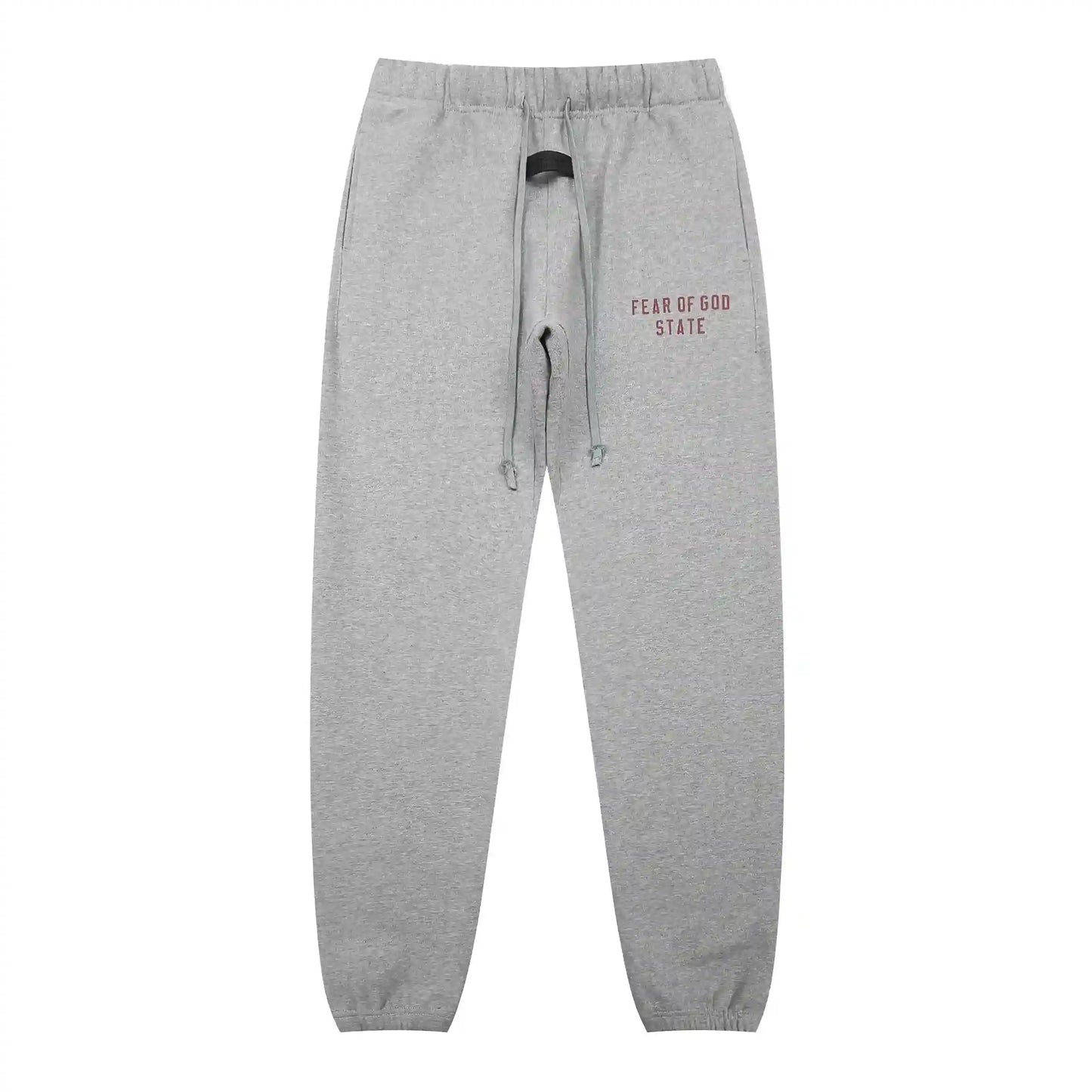 Dark heather oatmeal Essentials joggers soft-touch rubberized logo on leg close-up