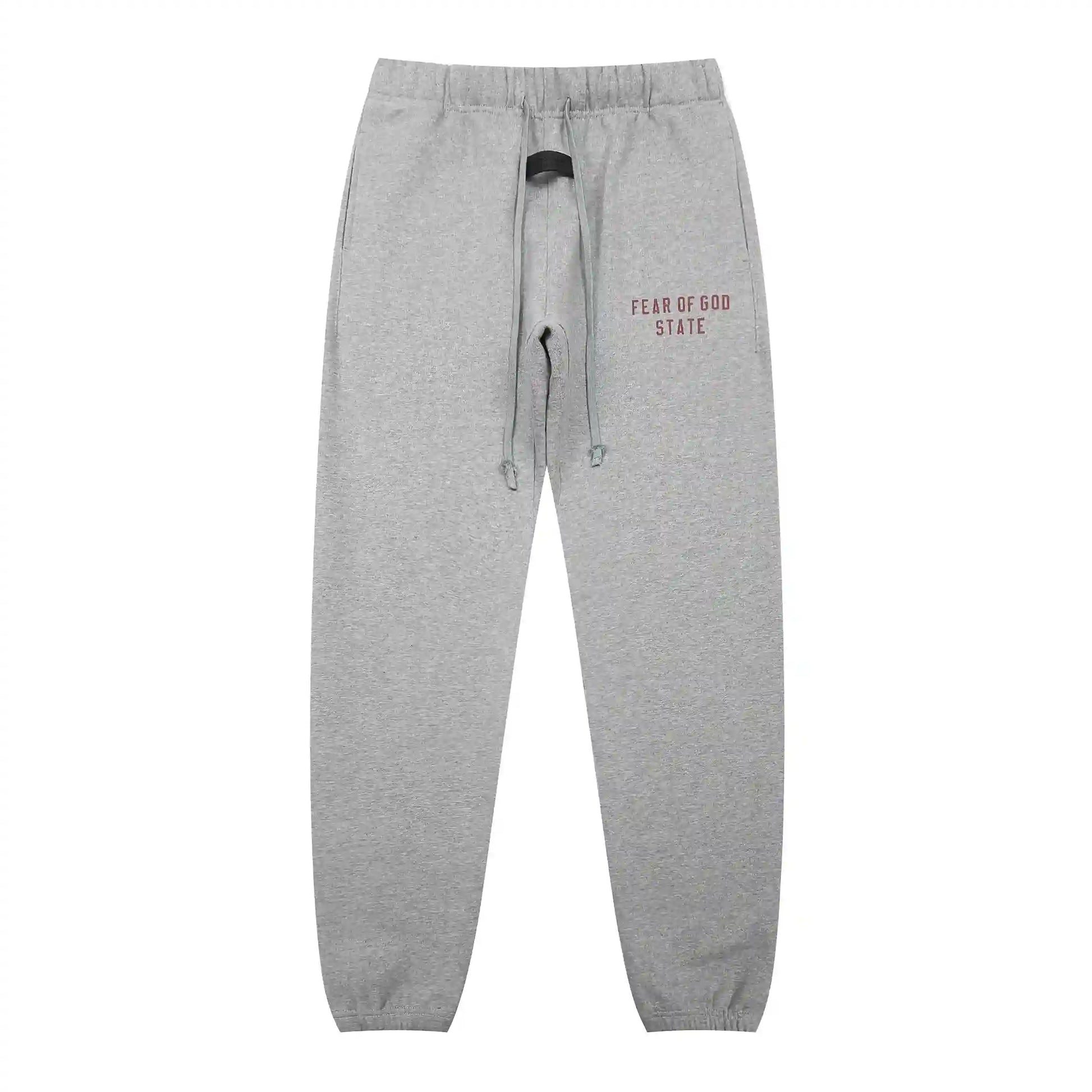 Dark heather oatmeal Essentials joggers soft-touch rubberized logo on leg close-up