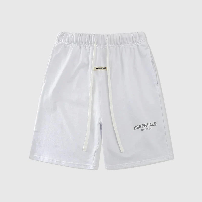Fear of God Essentials fleece shorts in eggshell white with tonal branding and relaxed fit