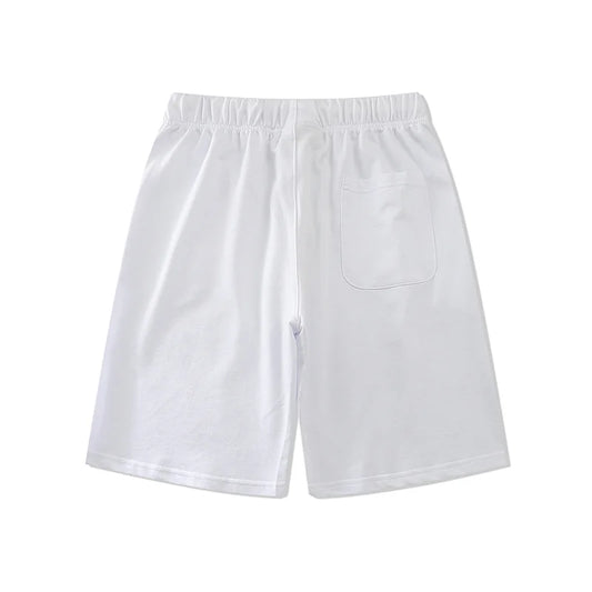 Fear of God Essentials fleece shorts in eggshell white with tonal branding and relaxed fit