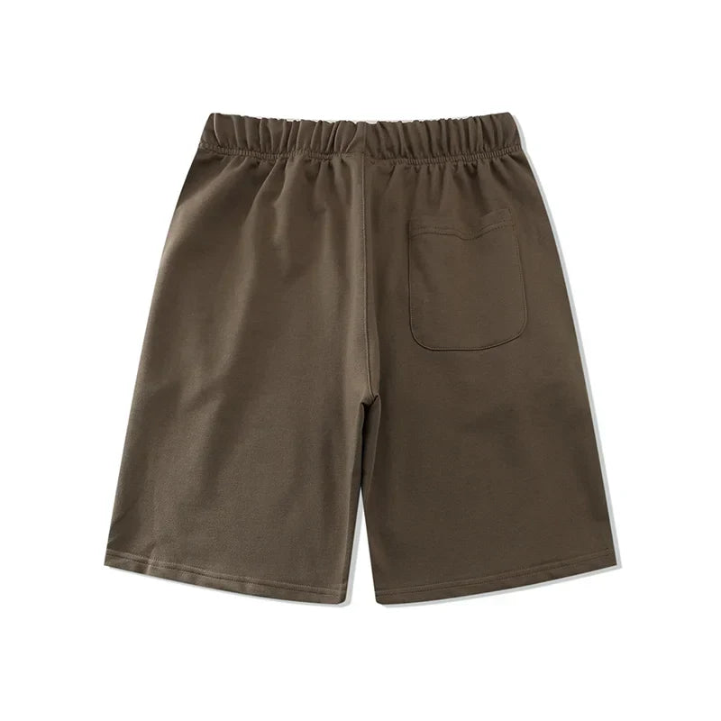 Fear of God Essentials tobacco brown fleece shorts with tonal logo and relaxed silhouette