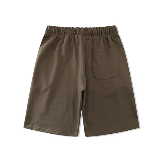 Fear of God Essentials tobacco brown fleece shorts with tonal logo and relaxed silhouette