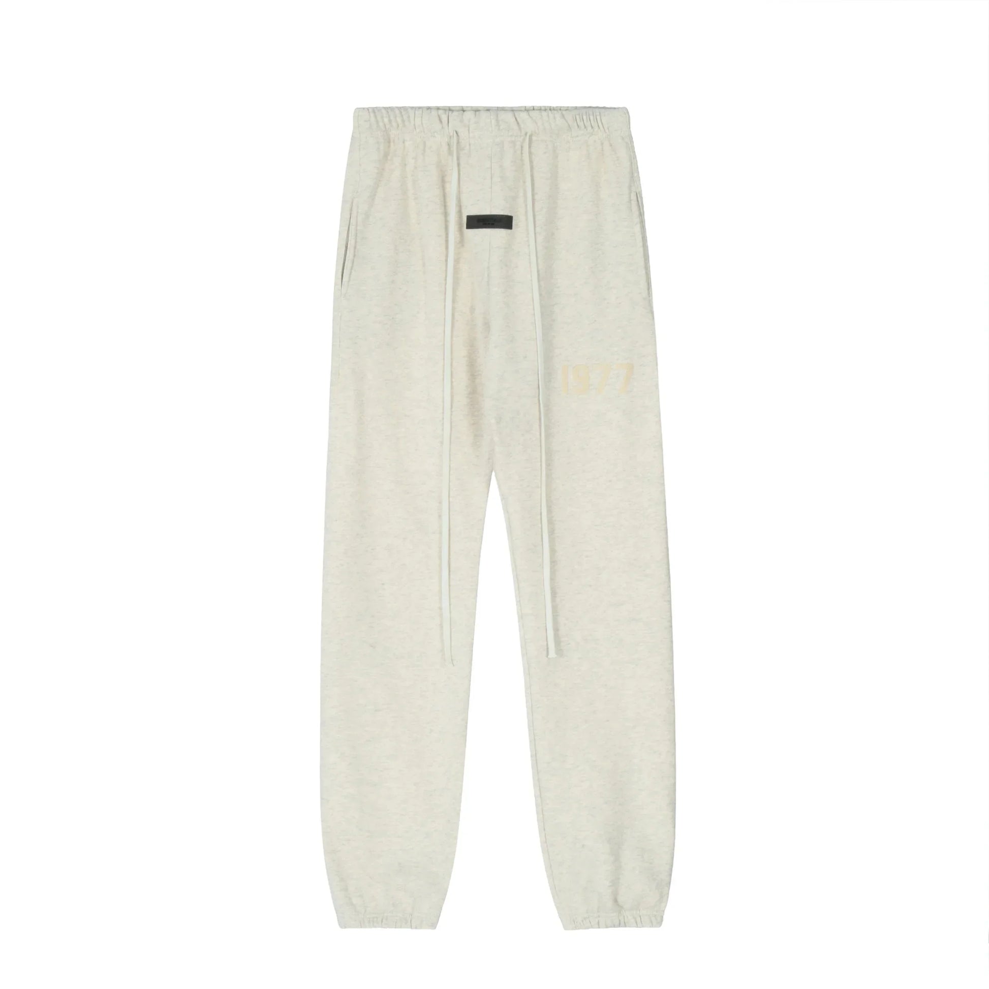 Cloud dance Essentials joggers soft-touch rubberized logo on leg close-up