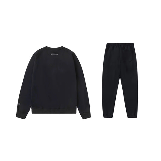 Essentials black elevated comfort fleece hoodie with soft interior detail by Fear Of God